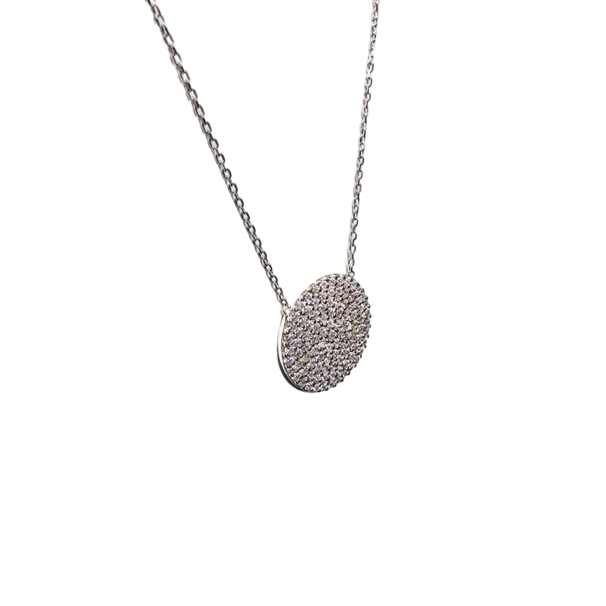 Side view of Luna pavé circle pendant necklace in sterling silver with cubic zirconia stones